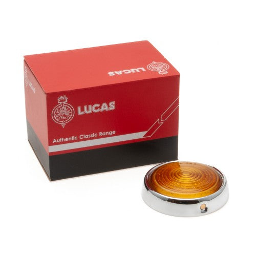 Amber indicator lens with chrome rim for Classic and Sportscar vehicles, showcasing clear detail and design.