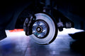 Classic and Sportscar Spares brake parts displayed on a workshop bench, showcasing quality and detail.